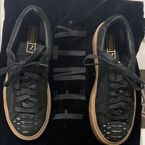 Puma suede Black and gold Sneakers